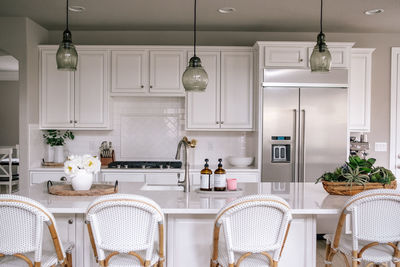 Horizontal portrait of a clean white kitchen