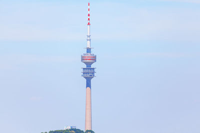 Low angle view of tower and building against sky