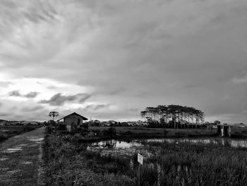 House on field against sky