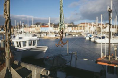Hanging hook fishing hook against sea and sky
