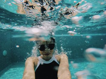 Close-up of woman swimming in pool