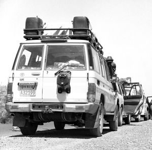 Low angle view of truck on field against clear sky