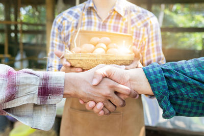 Midsection of man holding ice cream