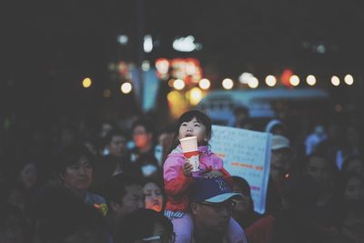 Woman standing at night