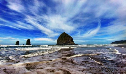 Scenic view of sea against blue sky