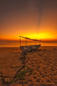 Scenic view of beach against sky during sunset