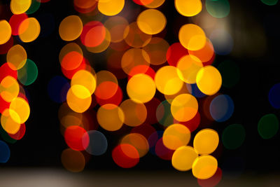 Defocused image of illuminated lights at night