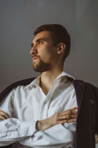 Portrait of young man looking away