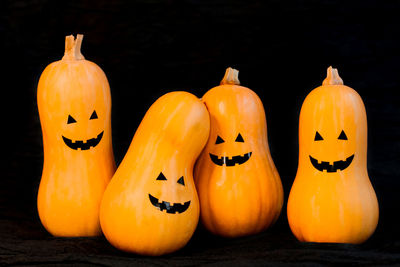 Close-up of pumpkins against black background