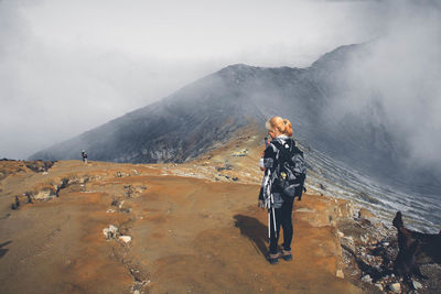 Full length of man standing on mountain