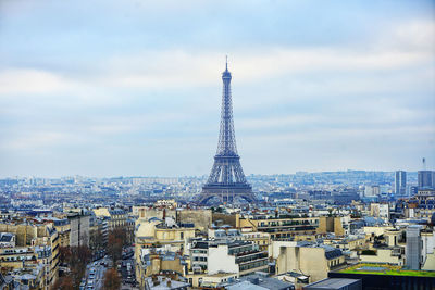 Cityscape against cloudy sky