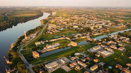 High angle view of river amidst buildings in city