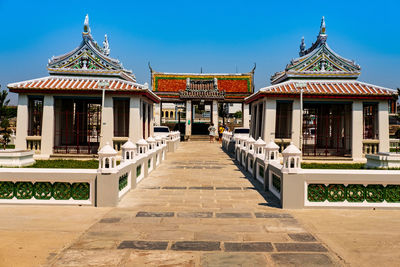 View of temple building against clear blue sky