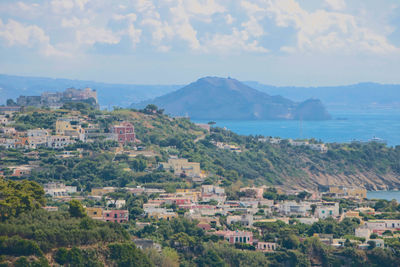 High angle view of townscape and mountains against sky