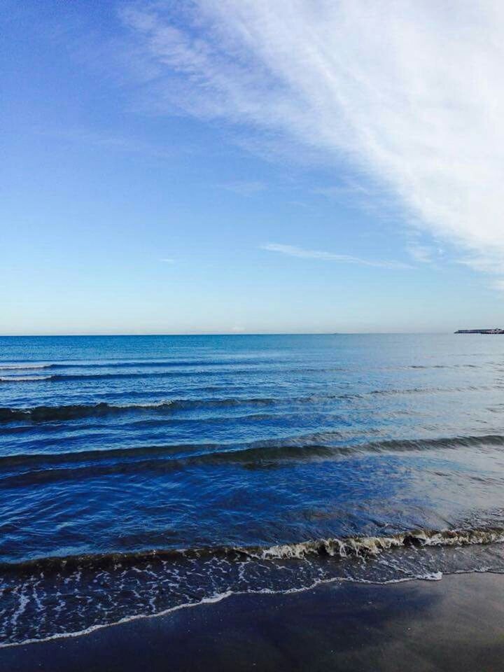 sea, horizon over water, water, beach, scenics, tranquil scene, sky, tranquility, shore, beauty in nature, nature, wave, idyllic, sand, blue, seascape, surf, coastline, remote, calm