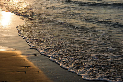 High angle view of sea shore during sunset