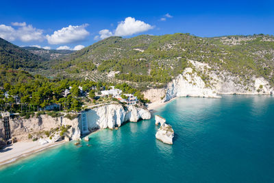 Aerial view of building on cliff by sea