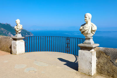 Statue against blue sky