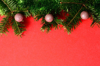 Close-up of christmas decorations on yellow background