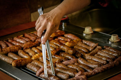 Close-up of hand preparing food