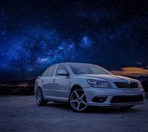 Vintage car on road at night