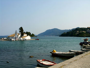 Boats moored in sea