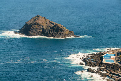 High angle view of rock formation in sea