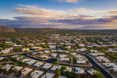 Green valley arizona, row homes with road and cut-de-sac at sunrise, aerial