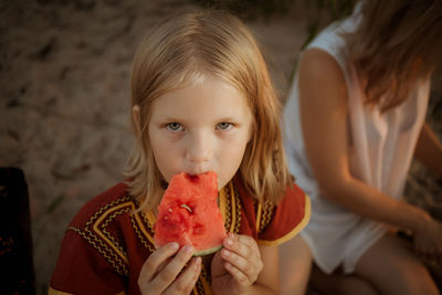 Portrait of girl eating watermelon