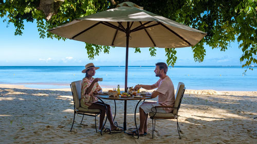 Chairs and lounge chair at beach