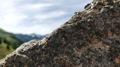 Low angle view of rock formation against sky