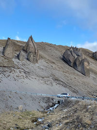 Rock formations on land against sky