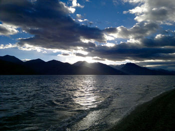 Scenic view of mountains against cloudy sky