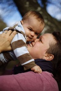 Close-up of father holding baby