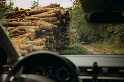 Tilt image of car on road seen through windshield