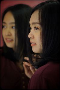 Portrait of young woman looking down