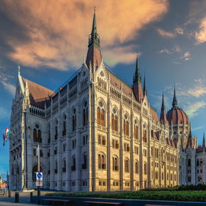 Parliament building on the embankment of budapest, hungary, on a sunny summer morning