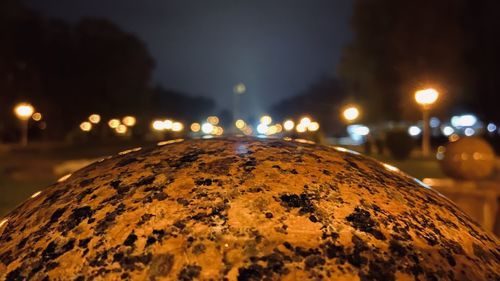 Close-up of illuminated street light at night