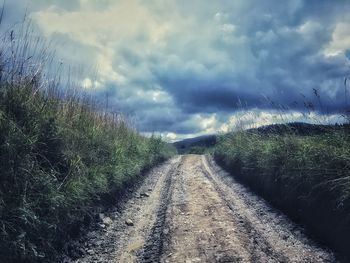 View of road against cloudy sky