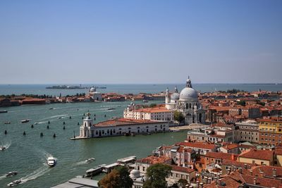 High angle view of cathedral in city by sea against sky