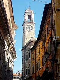 Low angle view of clock tower against sky