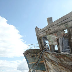 Low angle view of abandoned building against sky