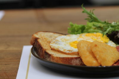 Close-up of food in plate on table for breakfast