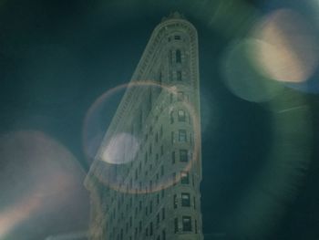 Low angle view of built structure against sky at night