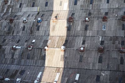 Shadow of man hanging on building