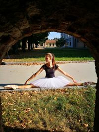 Ballet dancer seen through arch