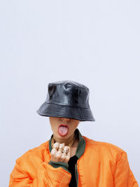 Woman wearing hat against white background