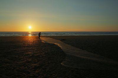 Scenic view of sea at sunset