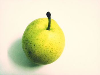 Close-up of fruit against white background