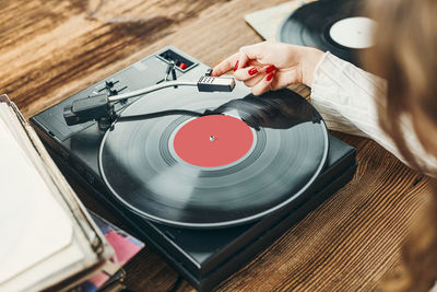 Listening to music from vinyl record. playing music. retro music party. vintage style. audiophile